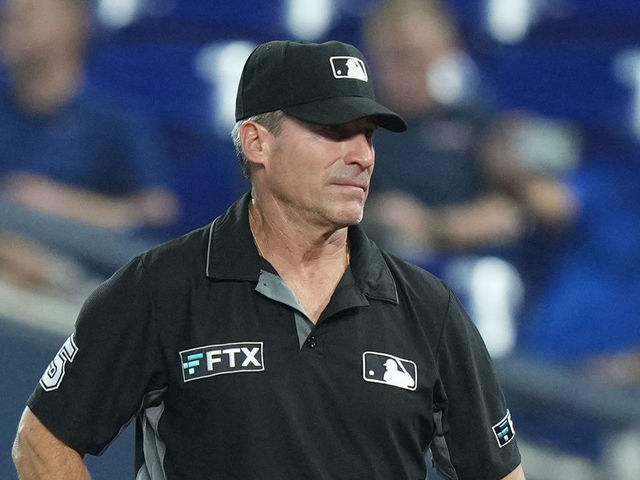 MIAMI, FL - AUGUST 29: Umpire Angel Hernandez (5) watches the game from first base during the game between the Los Angeles Dodgers and the Miami Marlins on Friday, August 29, 2022 at LoanDepot Park in Miami, FL