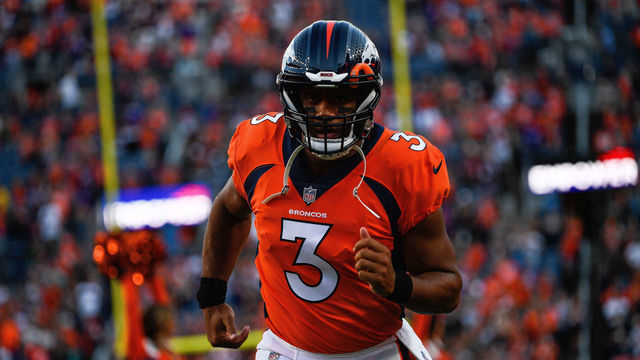 DENVER, COLORADO - AUGUST 27: Quarterback Russell Wilson #3 of the Denver Broncos runs onto the field before a preseason NFL game against the Minnesota Vikings at Empower Field at Mile High on August 27, 2022 in Denver, Colorado.