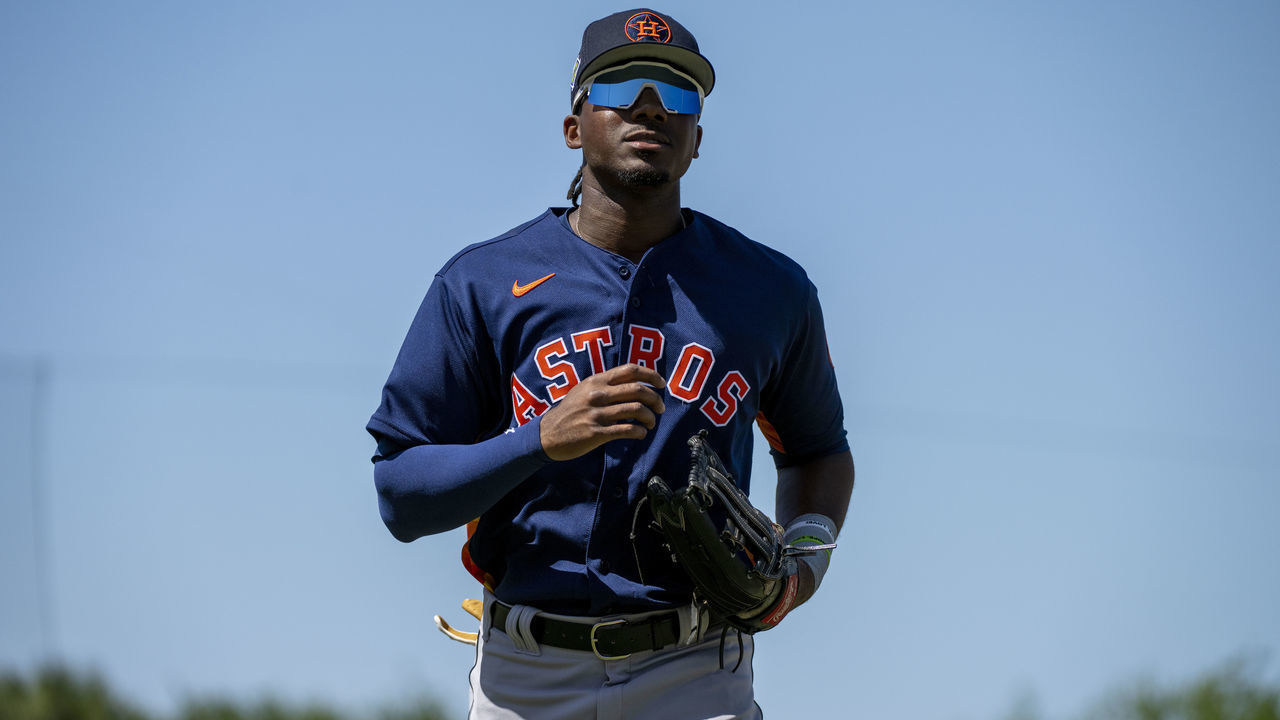 JUPITER, FL - MARCH 27: Houston Astros outfielder Lewis Brinson jogs back to the dugout during an MLB spring training game between the Houston Astros and the Miami Marlins at the Roger Dean Stadium on March 27, 2022 in Jupiter, Florida.