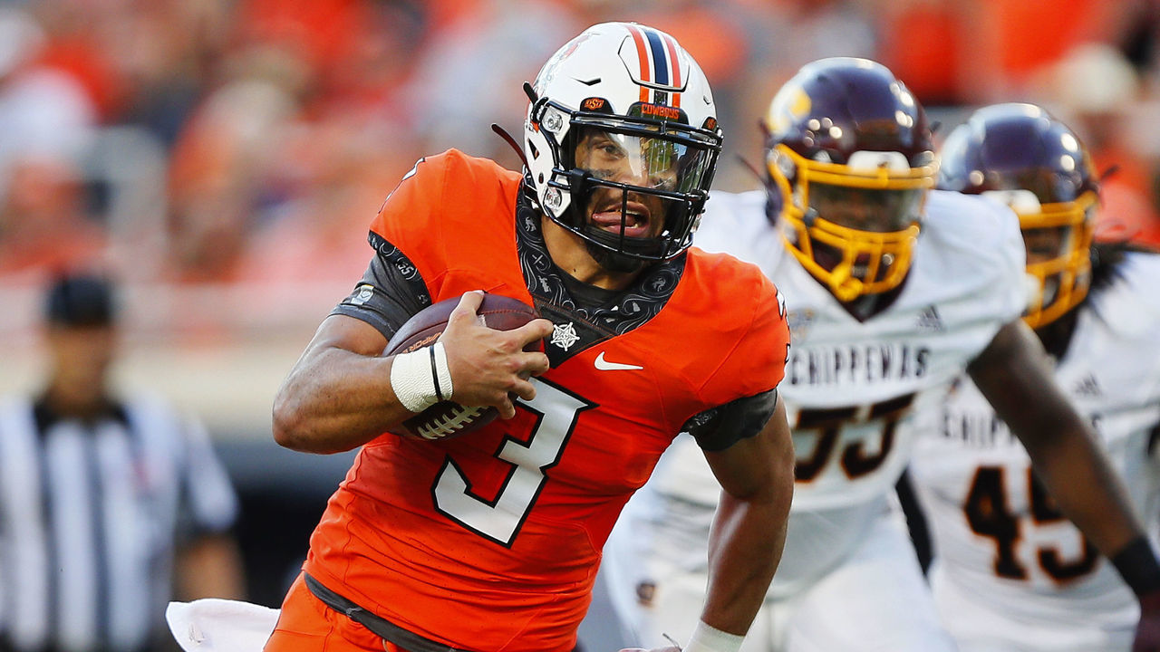 STILLWATER, OK - SEPTEMBER 1: Quarterback Spencer Sanders #3 of the Oklahoma State Cowboys breaks free for a 23-yard touchdown run against the Central Michigan Chippewas in the second quarter at Boone Pickens Stadium on September 1, 2022 in Stillwater, Oklahoma.