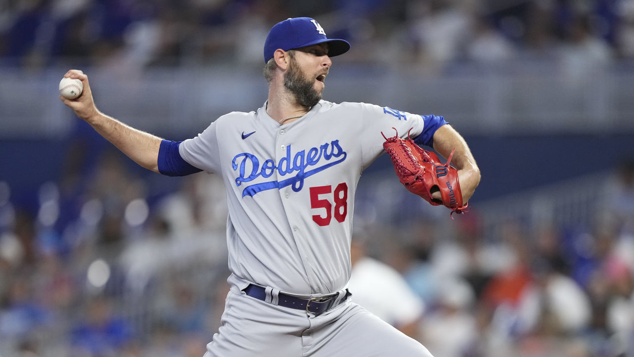 MIAMI, FLORIDA - AUGUST 28: Chris Martin #58 of the Los Angeles Dodgers pitches pitches in the eighth inning against the Miami Marlins at loanDepot park on August 28, 2022 in Miami, Florida.