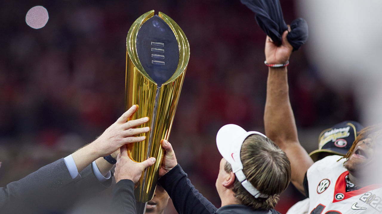 INDIANAPOLIS, IN - JANUARY 10: Georgia Bulldogs head coach Kirby Smart holds the national championship trophy after the Alabama Crimson Tide versus the Georgia Bulldogs in the College Football Playoff National Championship, on January 10, 2022, at Lucas Oil Stadium in Indianapolis, IN.
