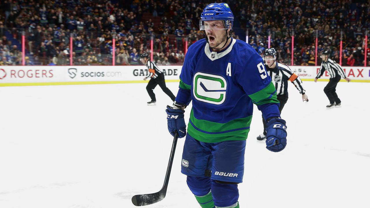 VANCOUVER, BC - DECEMBER 8: J.T. Miller #9 of the Vancouver Canucks celebrates after scoring during their NHL game against the Boston Bruins at Rogers Arena December 8, 2021 in Vancouver, British Columbia, Canada. "n