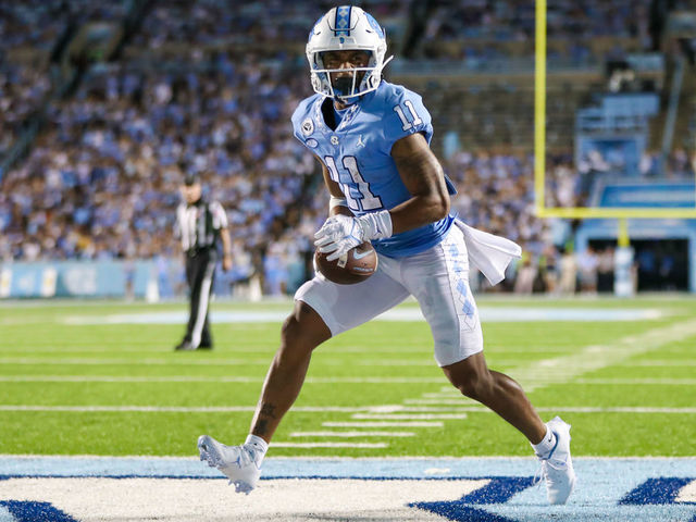 CHAPEL HILL, NC - AUGUST 27: Josh Downs (11) of the North Carolina Tar Heels reacts to the whistle being blown just before scoring a touchdown during a football game between the North Carolina Tar Heels and the Florida A&M Rattlers on August 27, 2022, at Kenan Memorial Stadium in Chapel Hill, NC.