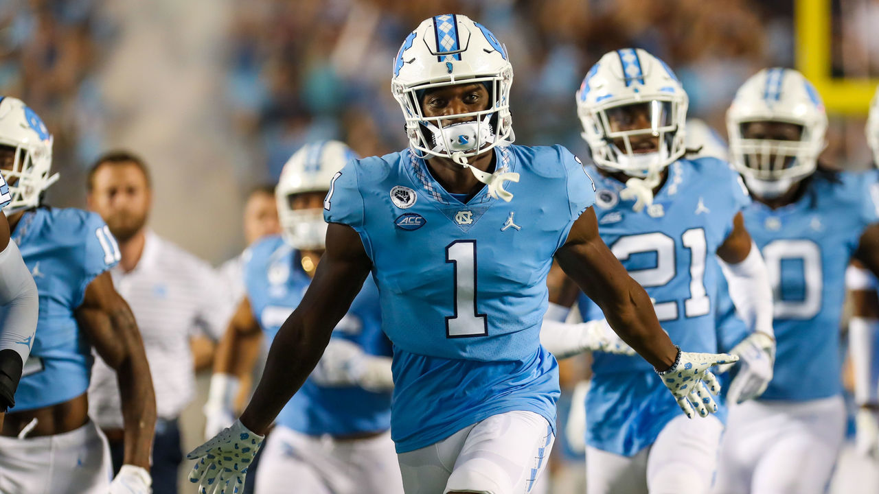 CHAPEL HILL, NC - AUGUST 27: Tony Grimes (1) of the North Carolina Tar Heels runs onto the field before a football game between the North Carolina Tar Heels and the Florida A&M Rattlers on August 27, 2022, at Kenan Memorial Stadium in Chapel Hill, NC.
