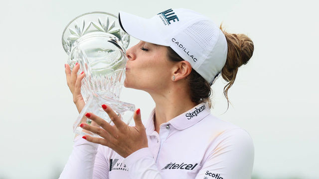 Gaby Lopez of Mexico City, Mexico holds the trophy on the 18th green during the trophy ceremony after winning the Dana Open presented by Marathon at Highland Meadows Golf Club in Sylvania, Ohio USA, on Sunday, September 4, 2022.