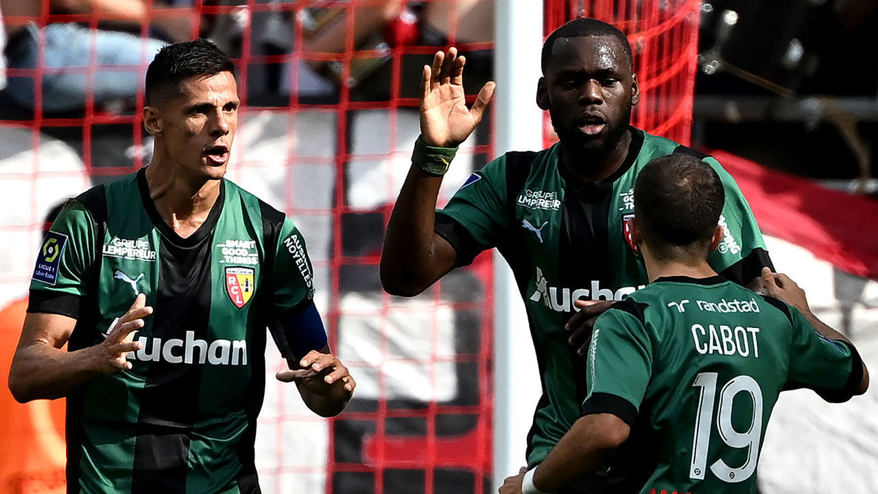 Lens' forward Lois Openda (2R) celebrates with teammates after scoring a goal during the French L1 football match between Stade de Reims and RC Lens at Stade Auguste-Delaune in Reims, northern France on September 4, 2022.