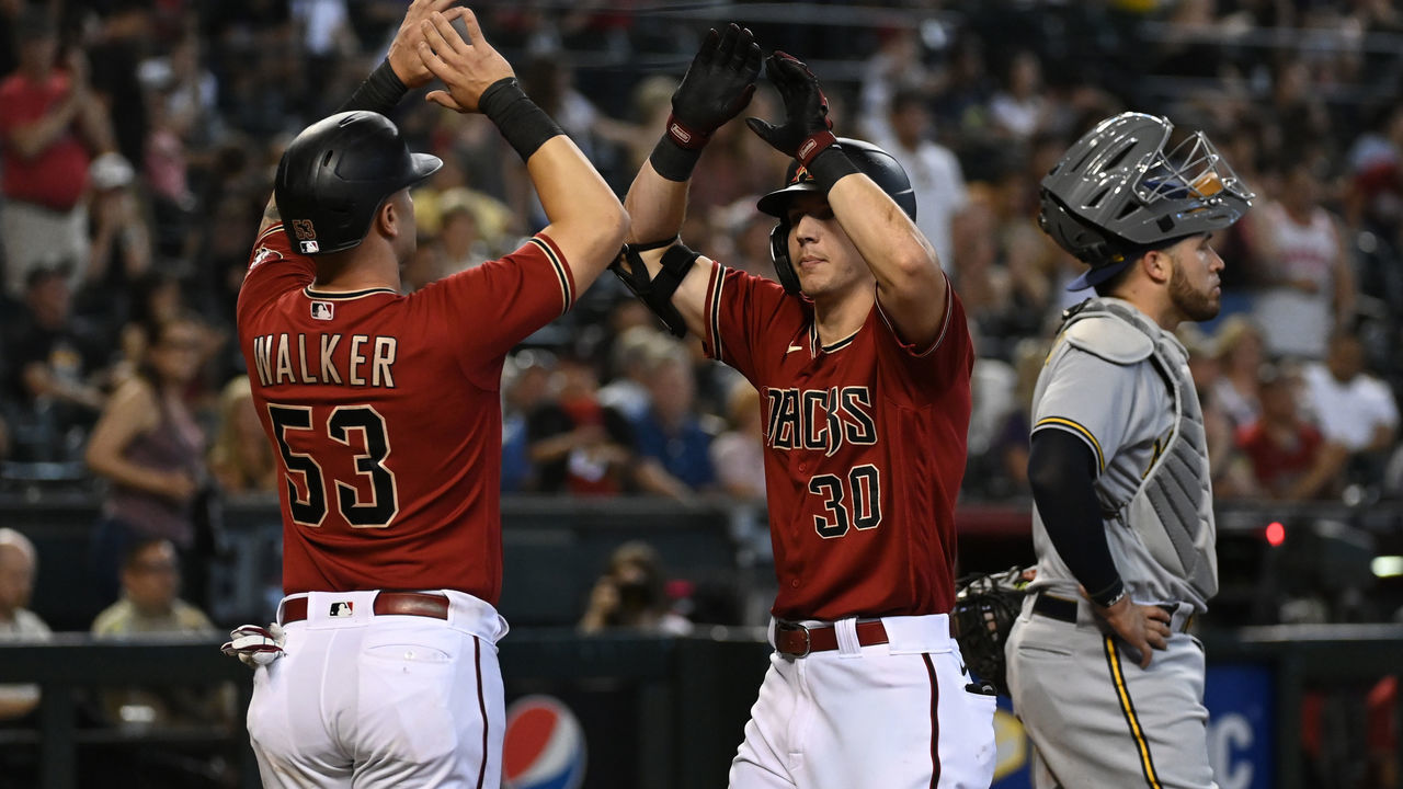 PHOENIX, ARIZONA - SEPTEMBER 04: Jake McCarthy #30 of the Arizona Diamondbacks celebrates his two-run home run with Christian Walker #53 against the Milwaukee Brewers during the eighth inning at Chase Field on September 04, 2022 in Phoenix, Arizona. Diamondbacks won 5-1.