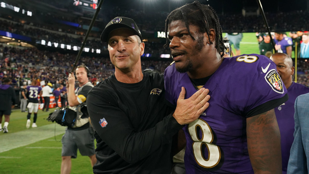 BALTIMORE, MARYLAND - SEPTEMBER 19: Lamar Jackson #8 of the Baltimore Ravens hugs head coach John Harbaugh against the Kansas City Chiefs after an NFL game at M&T Bank Stadium on September 19, 2021 in Baltimore, Maryland.