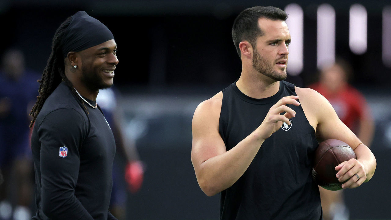 LAS VEGAS, NEVADA - AUGUST 26: Wide receiver Davante Adams (L) #17 and quarterback Derek Carr #4 of the Las Vegas Raiders talk as they warm up before a preseason game against the New England Patriots at Allegiant Stadium on August 26, 2022 in Las Vegas, Nevada. The Raiders defeated the Patriots 23-6.