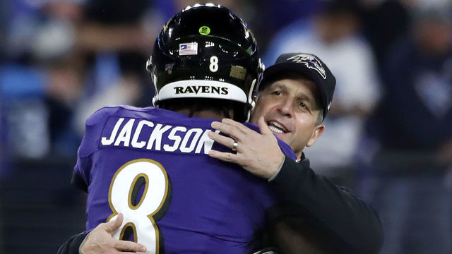 BALTIMORE, MARYLAND - JANUARY 11: Head coach John Harbaugh of the Baltimore Ravens and quarterback Lamar Jackson #8 embrace prior to the AFC Divisional Playoff game against the Tennessee Titans at M&T Bank Stadium on January 11, 2020 in Baltimore, Maryland.
