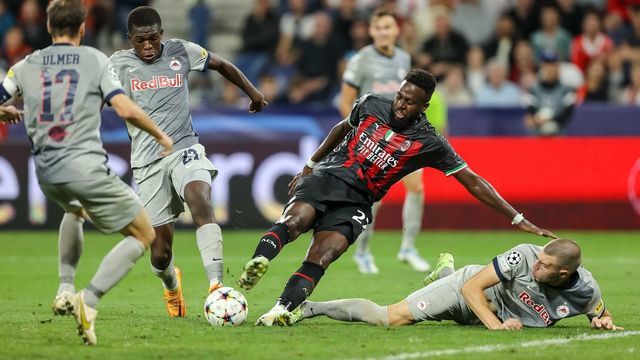 SALZBURG, AUSTRIA - SEPTEMBER 06: Lucas Gourna-Douath of Red Bull Salzburg, Divock Origi of AC Milan and Strahinja Pavlovic of Red Bull Salzburg battle for the ball during the UEFA Champions League group E match between FC Salzburg and AC Milan at Football Arena Salzburg on September 6, 2022 in Salzburg, Austria.