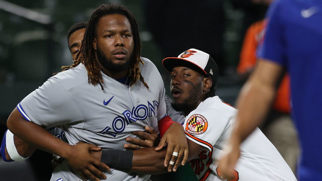 BALTIMORE, MARYLAND - SEPTEMBER 06: Vladimir Guerrero Jr. #27 of the Toronto Blue Jays is held back by Jorge Mateo #3 of the Baltimore Orioles after the benches cleared during the seventh inning at Oriole Park at Camden Yards on September 06, 2022 in Baltimore, Maryland.