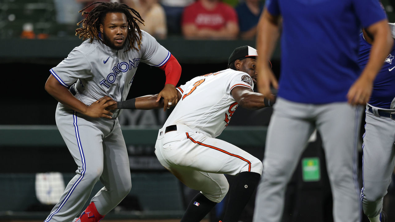 BALTIMORE, MARYLAND - SEPTEMBER 06: Vladimir Guerrero Jr. #27 of the Toronto Blue Jays is held back by Jorge Mateo #3 of the Baltimore Orioles after the benches cleared during the seventh inning at Oriole Park at Camden Yards on September 06, 2022 in Baltimore, Maryland.