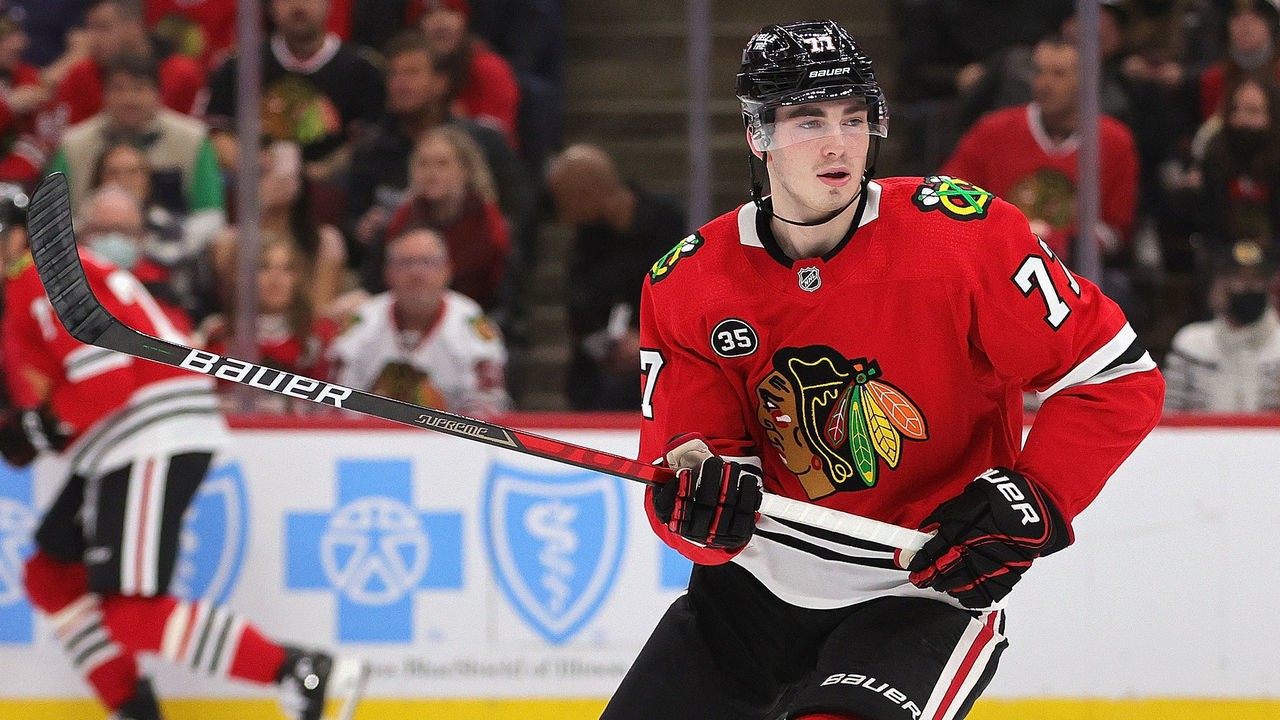 CHICAGO, ILLINOIS - DECEMBER 17: Kirby Dach #77 of the Chicago Blackhawks skates against the Nashville Predators at the United Center on December 17, 2021 in Chicago, Illinois. The Predators defeated the Blackhawks 3-2 in overtime.
