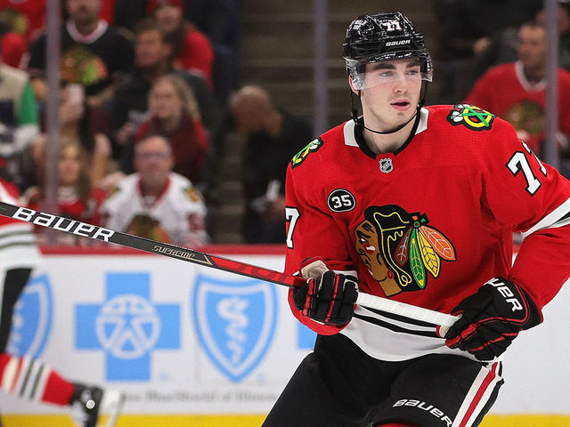 CHICAGO, ILLINOIS - DECEMBER 17: Kirby Dach #77 of the Chicago Blackhawks skates against the Nashville Predators at the United Center on December 17, 2021 in Chicago, Illinois. The Predators defeated the Blackhawks 3-2 in overtime.