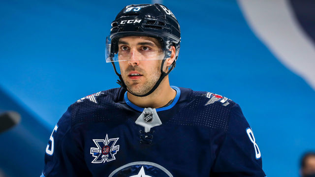 WINNIPEG, MB - MAY 10: Mathieu Perreault #85 of the Winnipeg Jets looks on during a second period stoppage of play against the Vancouver Canucks at Bell MTS Place on May 10, 2021 in Winnipeg, Manitoba.