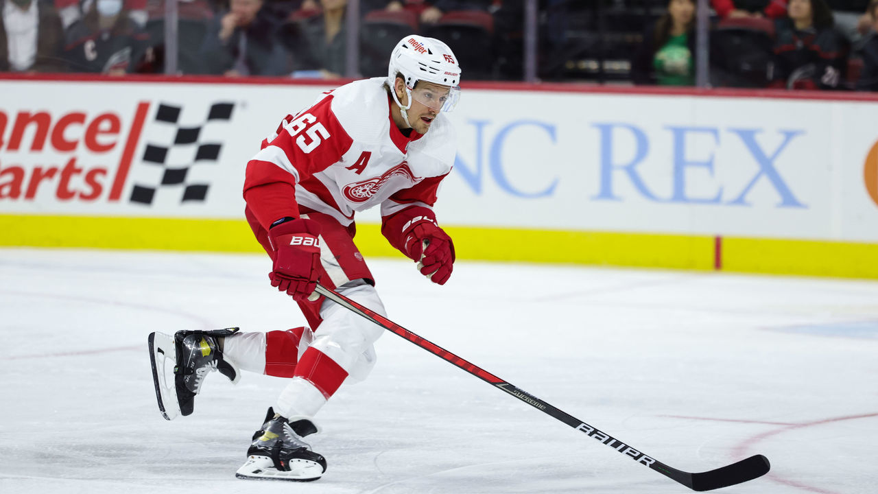RALEIGH, NC - DECEMBER 16: Danny DeKeyser #65 of the Detroit Red Wings skates for position on the ice during an NHL game against the Carolina Hurricanes on December 16, 2021 at PNC Arena in Raleigh, North Carolina.