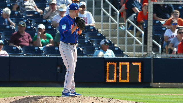 WEST PALM BEACH, FL - MARCH 11: Eric Hanhold #70 of the New York Mets gets set to deliver a pitch as the pitch clock counts down during the ninth inning of a spring training baseball game against the Houston Astros at Fitteam Ballpark of the Palm Beaches on March 11, 2019 in West Palm Beach, Florida. The Astros defeated the Mets 6-3.