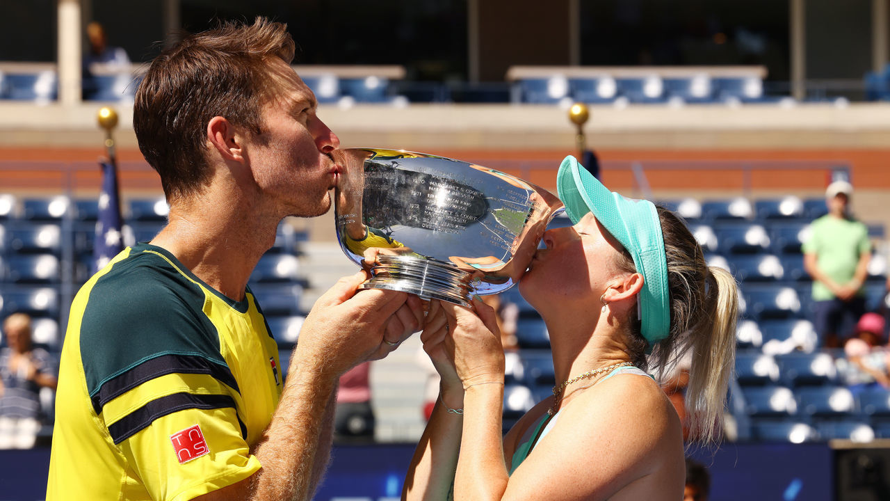 NEW YORK, NEW YORK - SEPTEMBER 10: Storm Sanders (R) of Australia and John Peers (L) of Australia celebrate with the championship trophy after defeating Kirsten Flipkens of Belgium and Edouard Roger-Vasselin of France during their Mixed Doubles Final match on Day Thirteen of the 2022 US Open at USTA Billie Jean King National Tennis Center on September 10, 2022 in the Flushing neighborhood of the Queens borough of New York City.