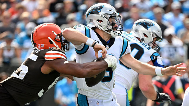 CHARLOTTE, NORTH CAROLINA - SEPTEMBER 11: Myles Garrett #95 of the Cleveland Browns strip sacks Baker Mayfield #6 of the Carolina Panthers during the third quarter at Bank of America Stadium on September 11, 2022 in Charlotte, North Carolina.