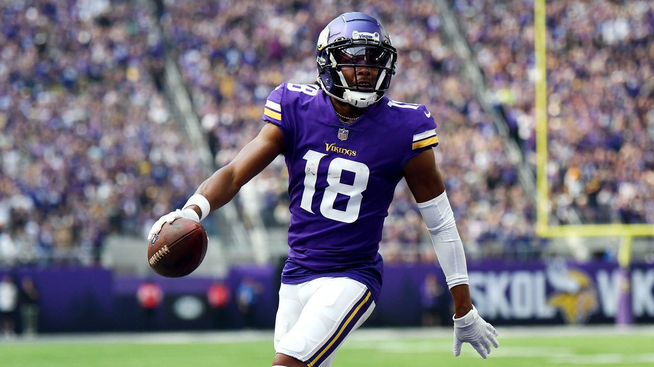 MINNEAPOLIS, MINNESOTA - SEPTEMBER 11: Justin Jefferson #18 of the Minnesota Vikings scores a touchdown during the first quarter in the game against the Green Bay Packers at U.S. Bank Stadium on September 11, 2022 in Minneapolis, Minnesota.