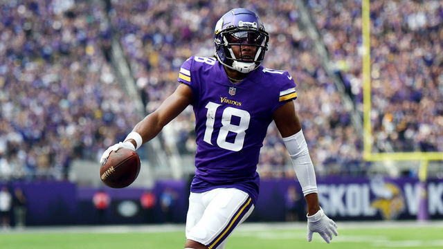 MINNEAPOLIS, MINNESOTA - SEPTEMBER 11: Justin Jefferson #18 of the Minnesota Vikings scores a touchdown during the first quarter in the game against the Green Bay Packers at U.S. Bank Stadium on September 11, 2022 in Minneapolis, Minnesota.