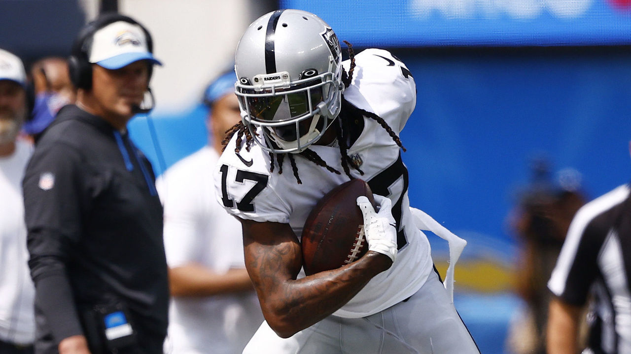 INGLEWOOD, CALIFORNIA - SEPTEMBER 11: Wide receiver Davante Adams #17 of the Las Vegas Raiders is knocked out of bounds by safety Duron Harmon #30 of the Las Vegas Raiders during the first half at SoFi Stadium on September 11, 2022 in Inglewood, California.
