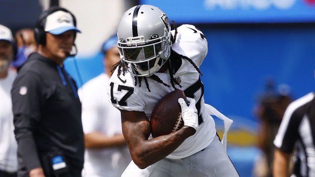 INGLEWOOD, CALIFORNIA - SEPTEMBER 11: Wide receiver Davante Adams #17 of the Las Vegas Raiders is knocked out of bounds by safety Duron Harmon #30 of the Las Vegas Raiders during the first half at SoFi Stadium on September 11, 2022 in Inglewood, California.