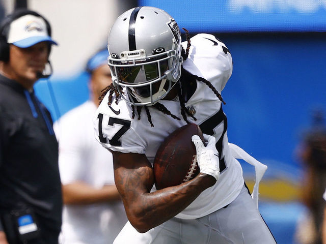 INGLEWOOD, CALIFORNIA - SEPTEMBER 11: Wide receiver Davante Adams #17 of the Las Vegas Raiders is knocked out of bounds by safety Duron Harmon #30 of the Las Vegas Raiders during the first half at SoFi Stadium on September 11, 2022 in Inglewood, California.