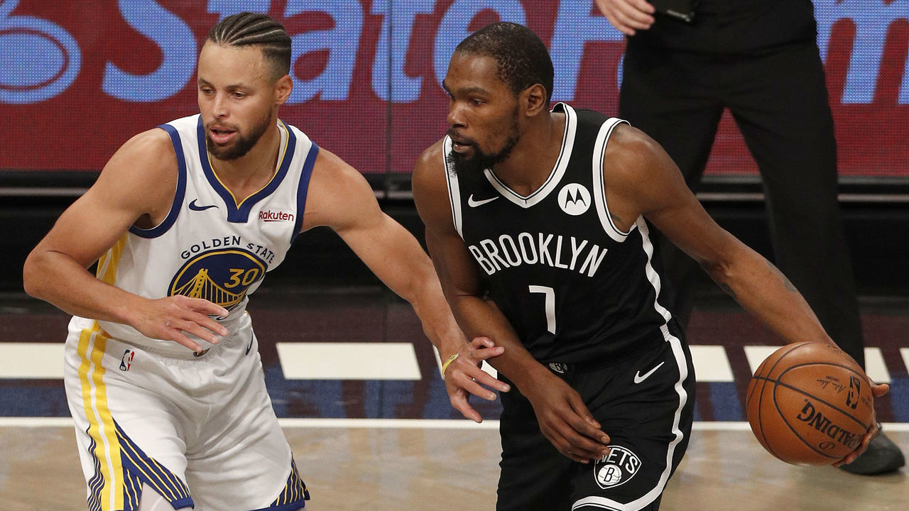 NEW YORK, NEW YORK - DECEMBER 22: (NEW YORK DAILIES OUT) Kevin Durant #7 of the Brooklyn Nets in action against Stephen Curry #30 of the Golden State Warriors at Barclays Center on December 22, 2020 in New York City. The Nets defeated the Warriors 125-99. NOTE TO USER: User expressly acknowledges and agrees that, by downloading and/or using this photograph, user is consenting to the terms and conditions of the Getty Images License Agreement.