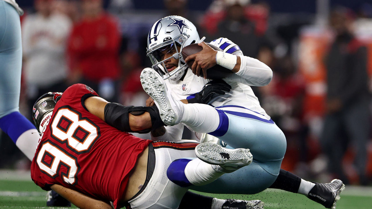 ARLINGTON, TEXAS - SEPTEMBER 11: Anthony Nelson #98 of the Tampa Bay Buccaneers sacks Dak Prescott #4 of the Dallas Cowboys during the second half at AT&T Stadium on September 11, 2022 in Arlington, Texas.
