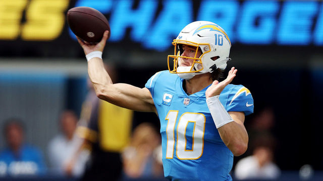 INGLEWOOD, CALIFORNIA - SEPTEMBER 11: Quarterback Justin Herbert #10 of the Los Angeles Chargers attempts a pass during the first half against the Las Vegas Raiders at SoFi Stadium on September 11, 2022 in Inglewood, California.