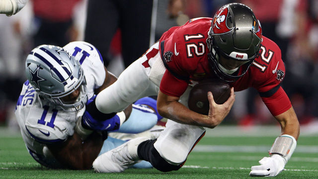 ARLINGTON, TEXAS - SEPTEMBER 11: Micah Parsons #11 of the Dallas Cowboys sacks Tom Brady #12 of the Tampa Bay Buccaneers during the first half at AT&T Stadium on September 11, 2022 in Arlington, Texas.