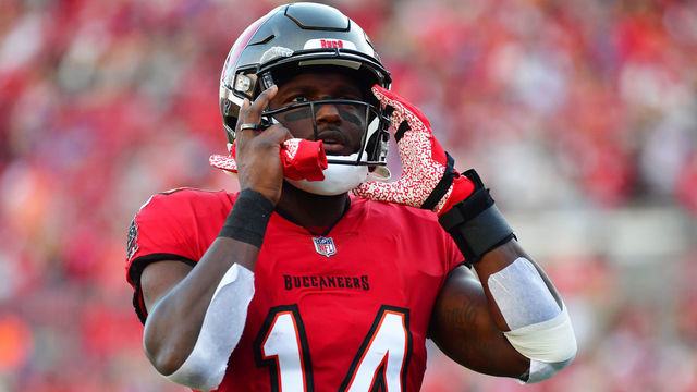 TAMPA, FLORIDA - DECEMBER 12: Chris Godwin #14 of the Tampa Bay Buccaneers adjusts his helmet prior to a game against the Buffalo Bills at Raymond James Stadium on December 12, 2021 in Tampa, Florida.