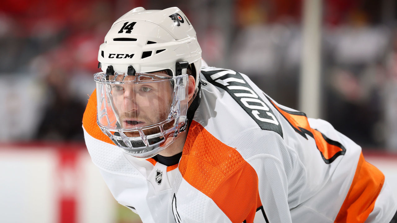 NEWARK, NEW JERSEY - DECEMBER 08: Sean Couturier #14 of the Philadelphia Flyers waits for the puck to drop against the New Jersey Devils during the first period at Prudential Center on December 08, 2021 in Newark, New Jersey. Tonight the New Jersey Devils are wearing their newly designed third jersey.