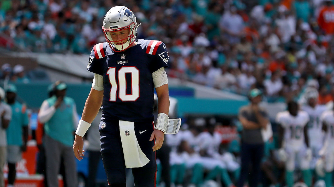 MIAMI GARDENS, FLORIDA - SEPTEMBER 11: Mac Jones #10 of the New England Patriots looks on against the Miami Dolphins during the third quarter at Hard Rock Stadium on September 11, 2022 in Miami Gardens, Florida.