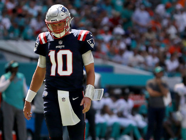 MIAMI GARDENS, FLORIDA - SEPTEMBER 11: Mac Jones #10 of the New England Patriots looks on against the Miami Dolphins during the third quarter at Hard Rock Stadium on September 11, 2022 in Miami Gardens, Florida.