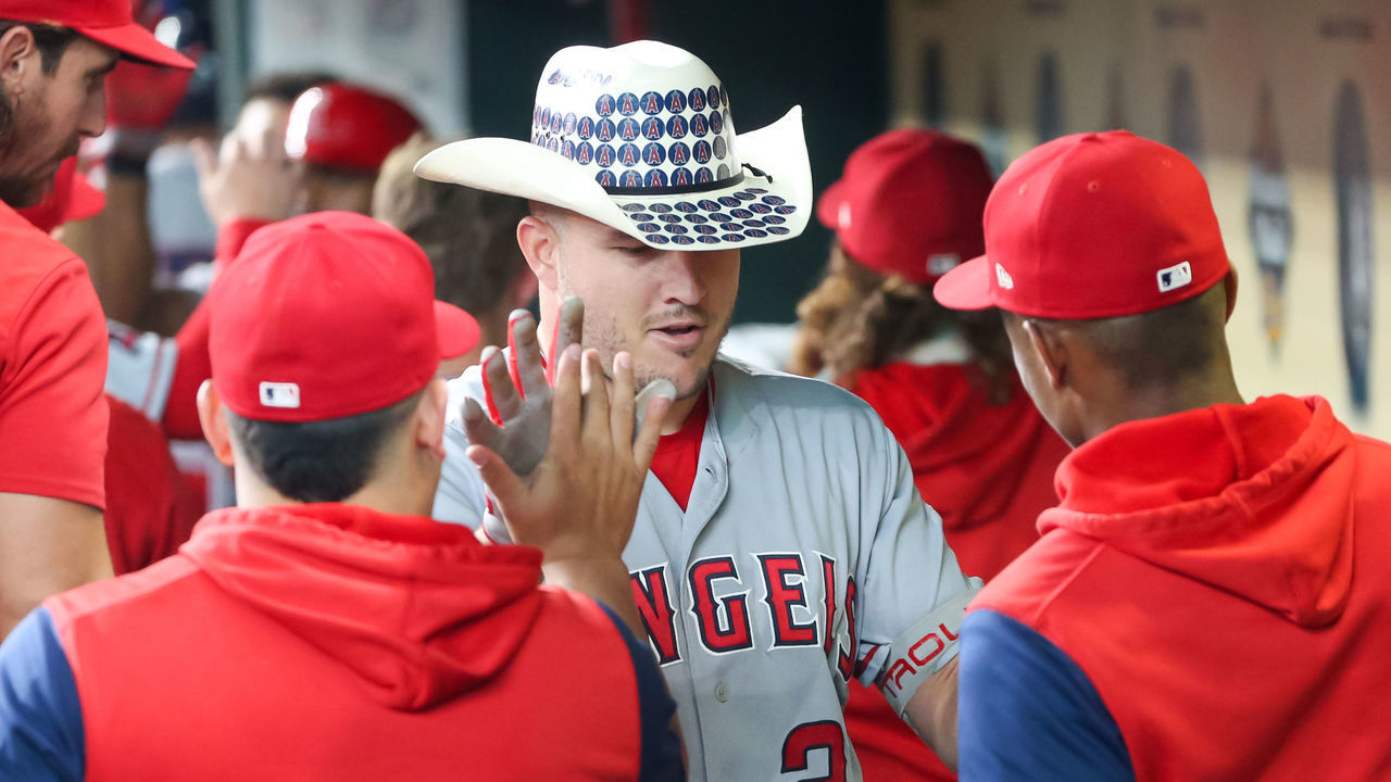HOUSTON, TX - SEPTEMBER 10: Los Angeles Angels center fielder Mike Trout (27) gets congratulated by teammates after hitting a 3-run home run in the top of the second inning during the MLB game between the Los Angeles Angels and Houston Astros on September 10, 2022 at Minute Maid Park in Houston, Texas.