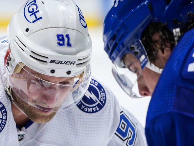 TORONTO, ON - NOVEMBER 4: Steven Stamkos #91 of the Tampa Bay Lightning takes a face-off against Auston Matthews #34 of the Toronto Maple Leafs during the second period at the Scotiabank Arena on November 4, 2021 in Toronto, Ontario, Canada.