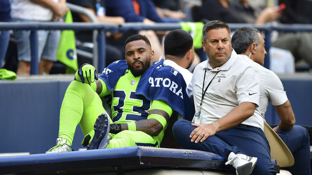 SEATTLE, WASHINGTON - SEPTEMBER 12: Jamal Adams #33 of the Seattle Seahawks is carted off the field during the second quarter against the Denver Broncos at Lumen Field on September 12, 2022 in Seattle, Washington.