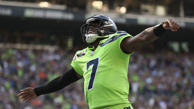 SEATTLE, WASHINGTON - SEPTEMBER 12: Geno Smith #7 of the Seattle Seahawks celebrates during the first quarter against the Denver Broncos at Lumen Field on September 12, 2022 in Seattle, Washington.