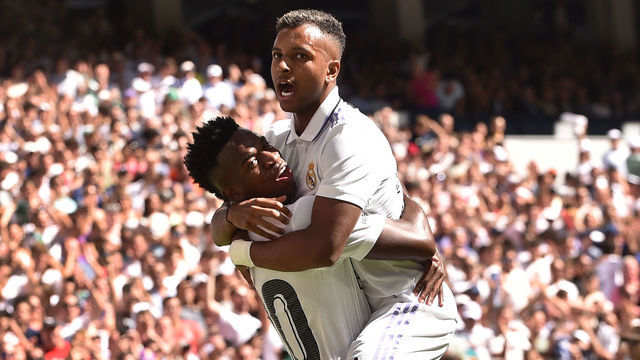 MADRID, SPAIN - SEPTEMBER 03: Vinicius Junior of Real Madrid celebrates with teammate Rodrygo Goes after scoring their team's opening goal during the LaLiga Santander match between Real Madrid CF and Real Betis at Estadio Santiago Bernabeu on September 03, 2022 in Madrid, Spain.
