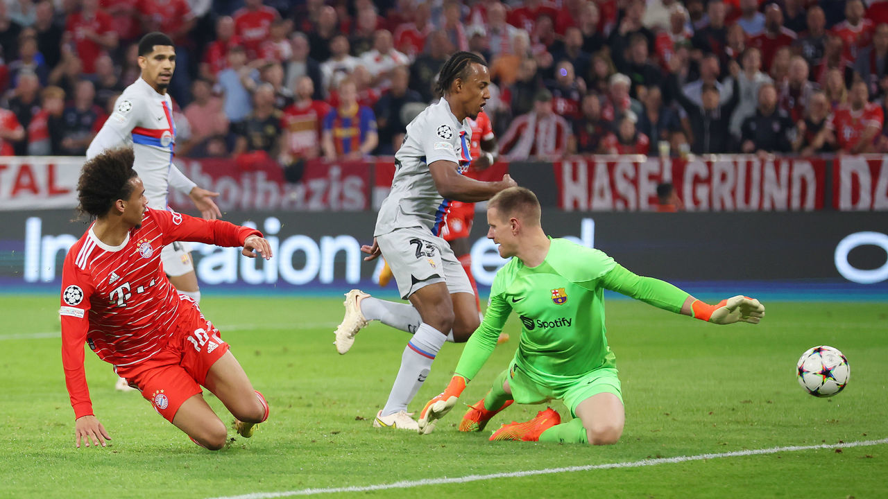 MUNICH, GERMANY - SEPTEMBER 13: Leroy Sane of Bayern Munich scores their side's second goal as Marc-Andre ter Stegen of FC Barcelona attempts to make a save during the UEFA Champions League group C match between FC Bayern München and FC Barcelona at Allianz Arena on September 13, 2022 in Munich, Germany.