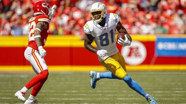 KANSAS CITY, MO - SEPTEMBER 26: Mike Williams #81 of the Los Angeles Chargers runs with the football during the second quarter away from Tyrann Mathieu #32 of the Kansas City Chiefs at Arrowhead Stadium on September 26, 2021 in Kansas City, Missouri.
