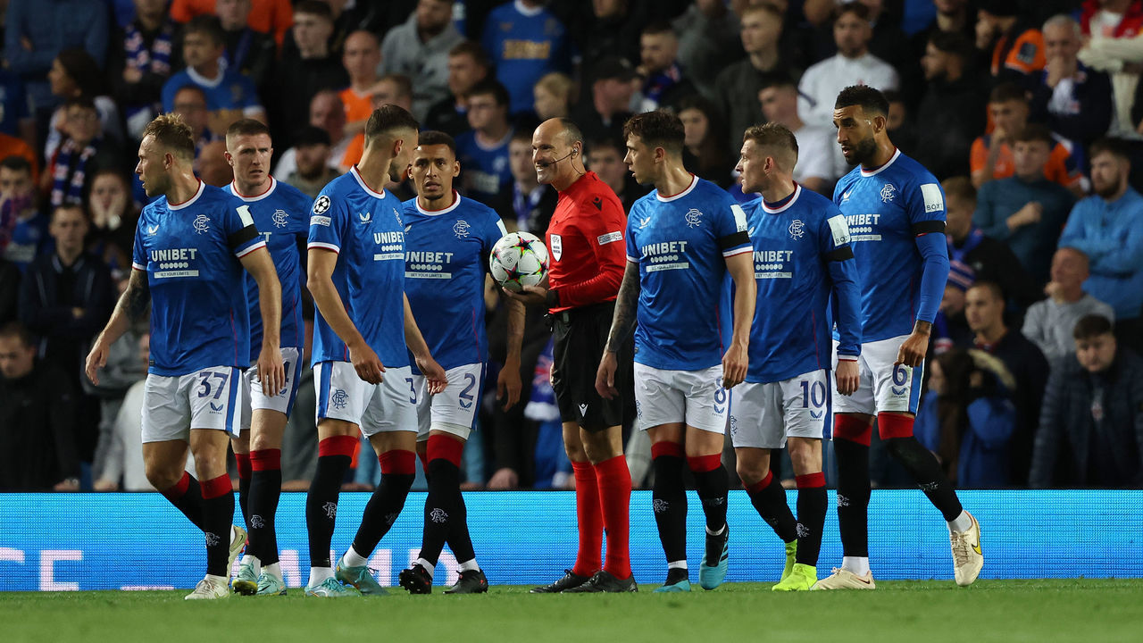 GLASGOW, SCOTLAND - SEPTEMBER 14: Rangers players follow referee Antonio Miguel Mateu Lahoz of Spain as they await a VAR decision during the UEFA Champions League group A match between Rangers FC and SSC Napoli at Ibrox Stadium on September 14, 2022 in Glasgow, United Kingdom.