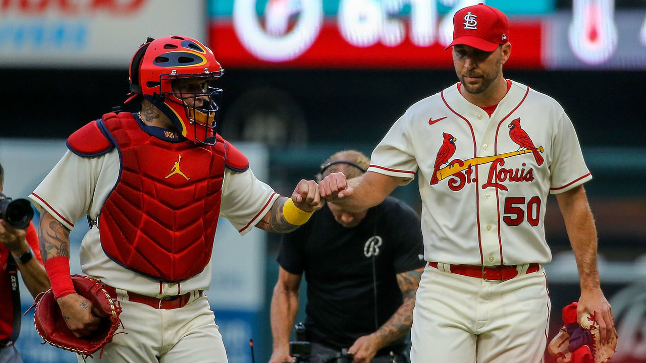 ST. LOUIS, MO - SEPTEMBER 03: Yadier Molina and Adam Wainwright #50 of the St. Louis Cardinals fist bump as they walk to the dugout prior to the game against the Chicago Cubs at Busch Stadium on September 3, 2022 in St. Louis, Missouri.