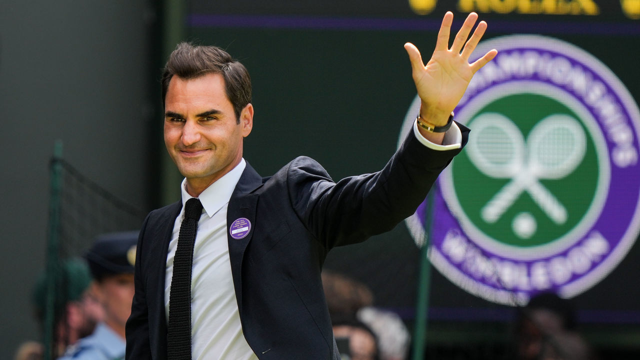 LONDON, ENGLAND - JULY 03: Roger Federer of Switzerland greets the audience during the Centre Court Centenary Celebration during day seven of The Championships Wimbledon 2022 at All England Lawn Tennis and Croquet Club on July 03, 2022 in London, England.