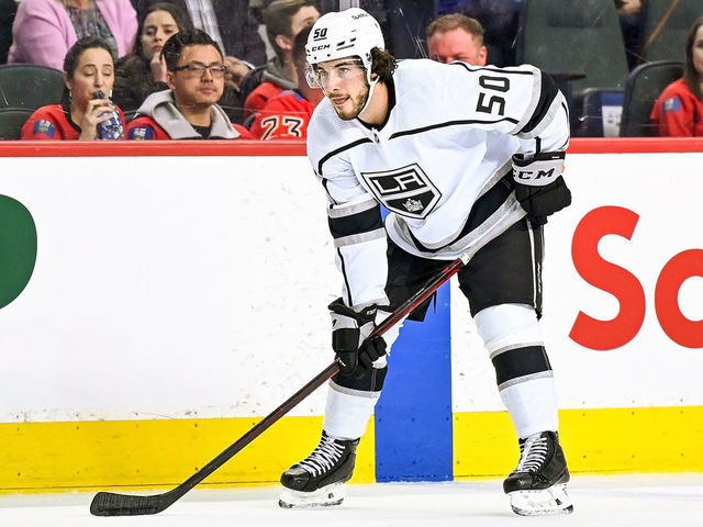 CALGARY, AB - MARCH 31: Los Angeles Kings Defenceman Sean Durzi (50) gets set for a face-off during the first period of an NHL game where the Calgary Flames hosted the Los Angeles Kings on March 31, 2022, at the Scotiabank Saddledome in Calgary, AB.