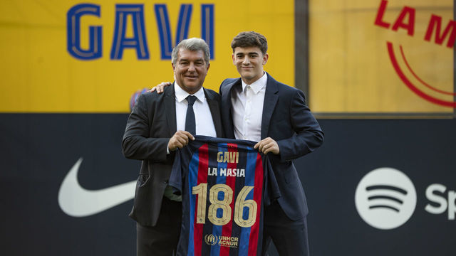 BARCELONA, SPAIN - SEPTEMBER 15: FC Barcelona's midfielder Gavi and FC Barcelona's President Joan Laporta pose during a Gaviâs ceremony of renewal his contract at the Nou Camp stadium in Barcelona on September 11, 2022